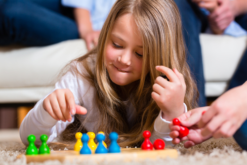 Girl playing ludo